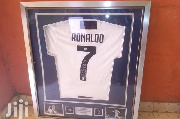 Signed and framed football jersey
